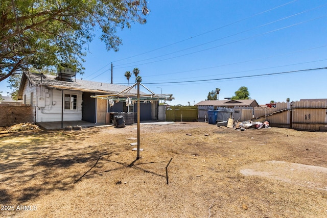 4048 W Granada Rd, Phoenix, AZ 85035 - rear view of property with a fenced backyard, a patio, and a garage