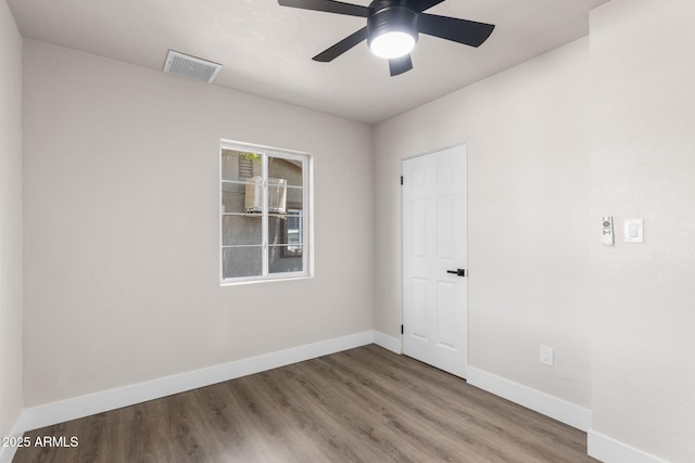 4048 W Granada Rd, Phoenix, AZ 85035 - spare room featuring wood finished floors and a ceiling fan