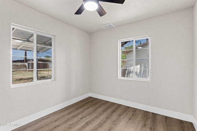 4048 W Granada Rd, Phoenix, AZ 85035 - spare room with wood finished floors and ceiling fan
