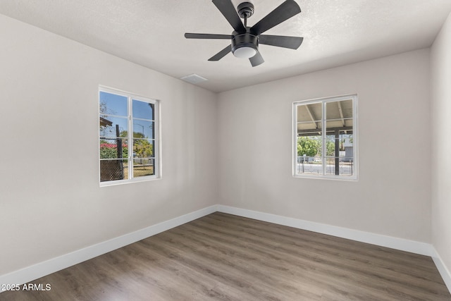 4048 W Granada Rd, Phoenix, AZ 85035 - spare room featuring wood finished floors and a ceiling fan