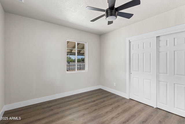 4048 W Granada Rd, Phoenix, AZ 85035 - unfurnished bedroom featuring wood finished floors, a closet, and ceiling fan
