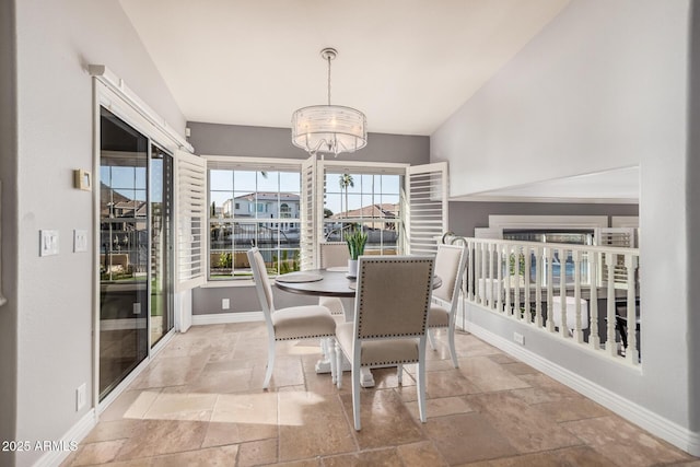 dining space with a notable chandelier