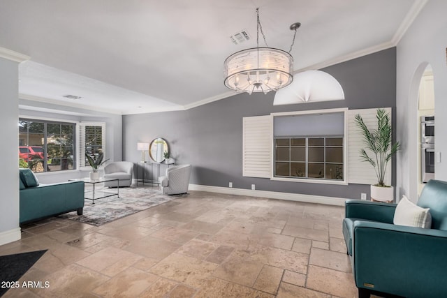 living room featuring ornamental molding and a chandelier