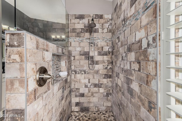 bathroom with tiled shower