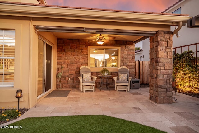 patio terrace at dusk with ceiling fan