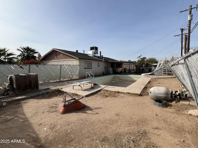 view of yard with an empty pool and a patio area