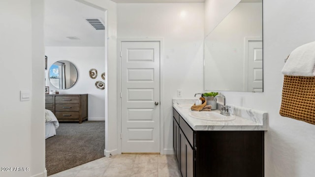 bathroom with vanity and visible vents