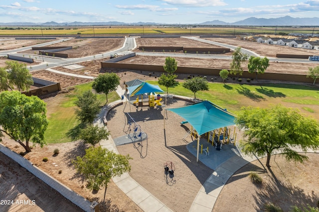 drone / aerial view with a mountain view and a rural view