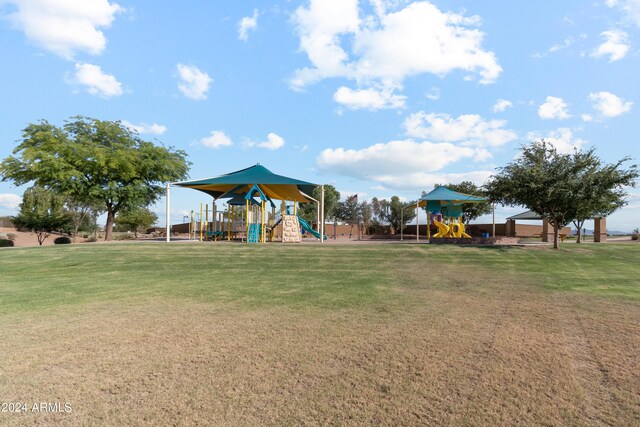 community playground featuring a lawn