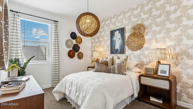 bedroom featuring carpet flooring, wallpapered walls, and baseboards