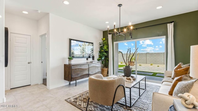 living area featuring recessed lighting, baseboards, light tile patterned floors, and a chandelier