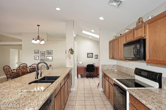 kitchen featuring black appliances, sink, hanging light fixtures, light stone counters, and light tile patterned floors