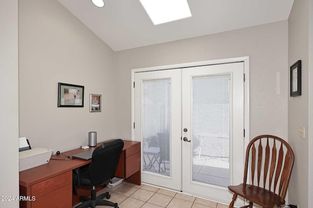 office featuring french doors, lofted ceiling, and light tile patterned flooring