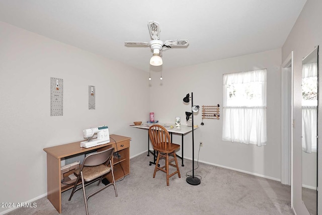 office featuring light colored carpet and ceiling fan