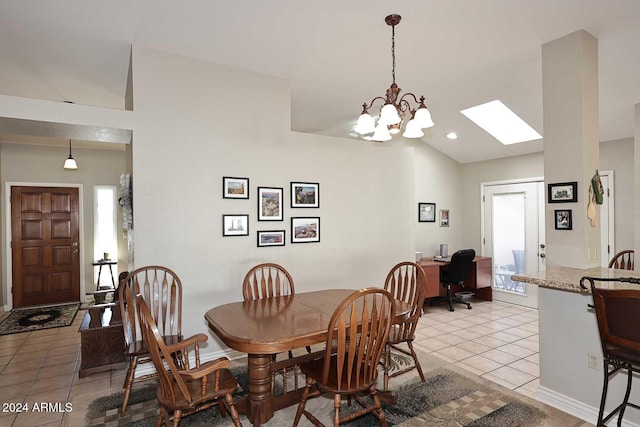 tiled dining space with plenty of natural light and a chandelier