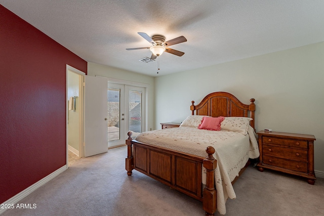 carpeted bedroom featuring ceiling fan, a textured ceiling, access to outside, and french doors