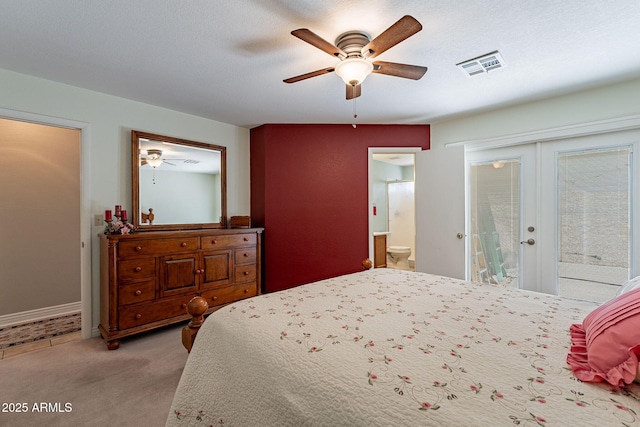 carpeted bedroom with ceiling fan, french doors, connected bathroom, and access to outside