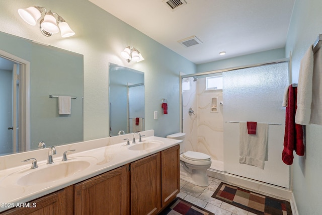 bathroom with tile patterned flooring, toilet, walk in shower, and vanity