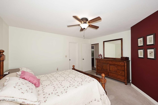 bedroom featuring ceiling fan and light colored carpet