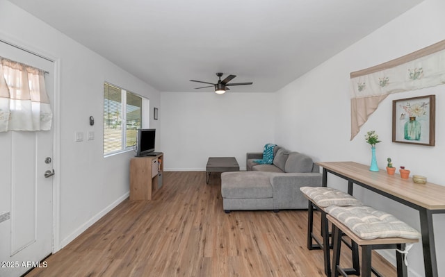 715 W Cinnabar Ave, Phoenix, AZ 85021 - living area with light wood-style flooring, baseboards, and ceiling fan