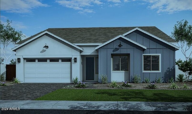 view of front facade featuring a front lawn and a garage