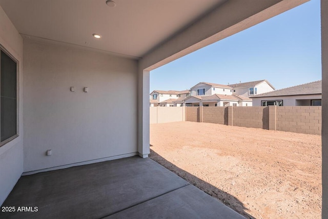 view of patio / terrace with a residential view and a fenced backyard