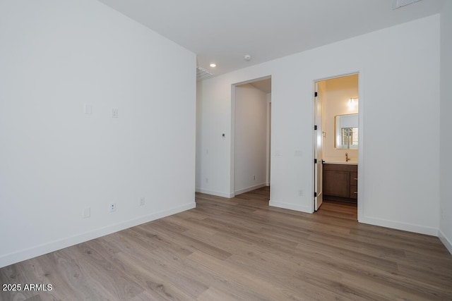 unfurnished room with recessed lighting, visible vents, wood finished floors, and baseboards