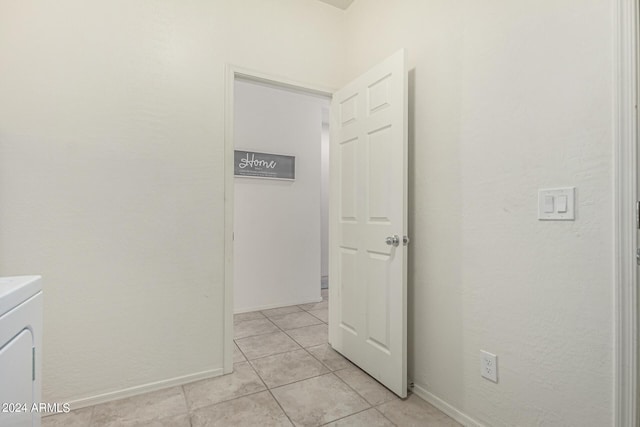 laundry room featuring light tile patterned floors and washer / clothes dryer