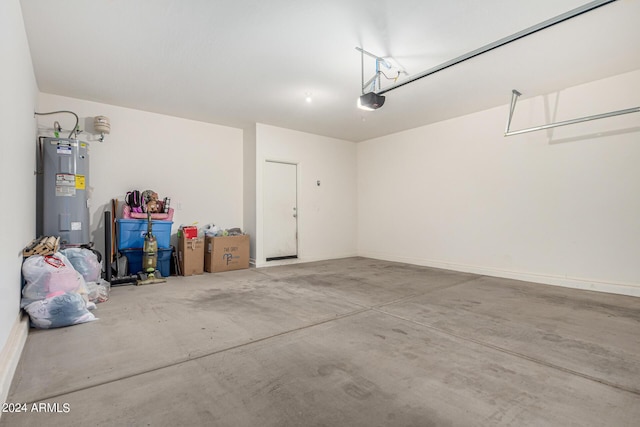 garage with a garage door opener and water heater