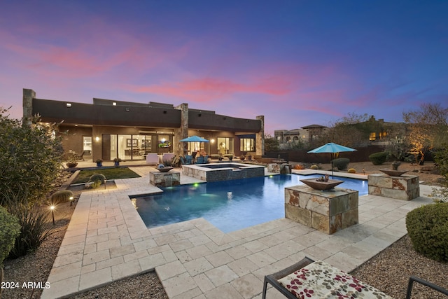 view of swimming pool featuring a patio area and a pool with connected hot tub