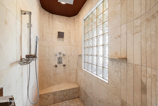 bathroom with tiled shower