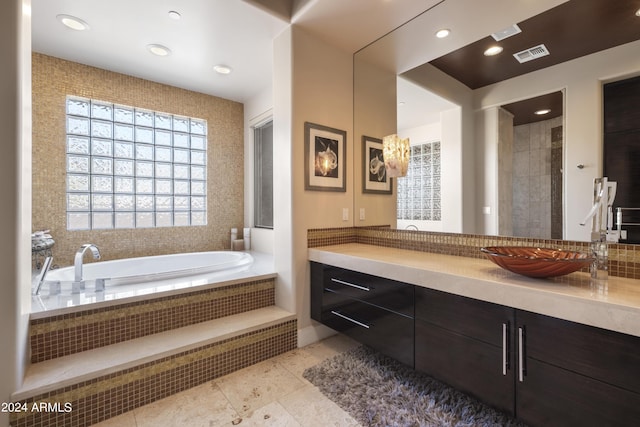 bathroom with tile patterned flooring, visible vents, recessed lighting, a bath, and vanity