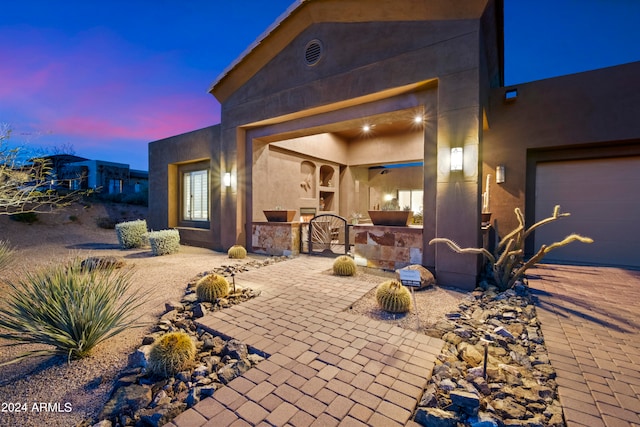 patio terrace at dusk with a garage