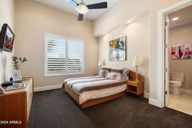 bedroom with connected bathroom, ceiling fan, and carpet