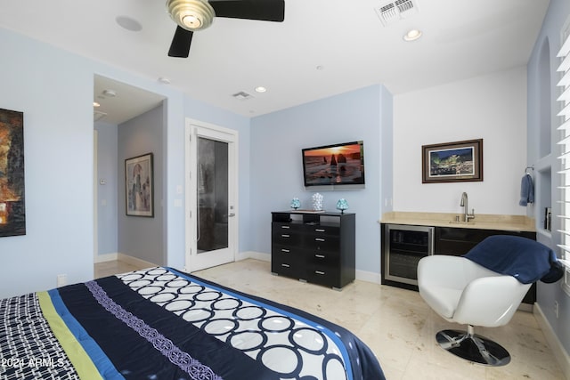 bedroom with visible vents, wine cooler, baseboards, and indoor wet bar