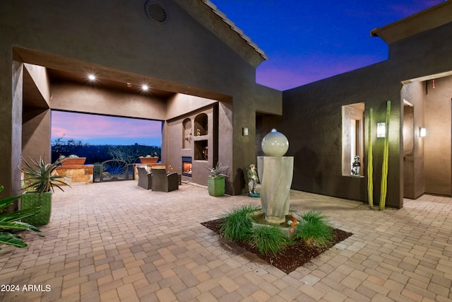 view of patio terrace at dusk