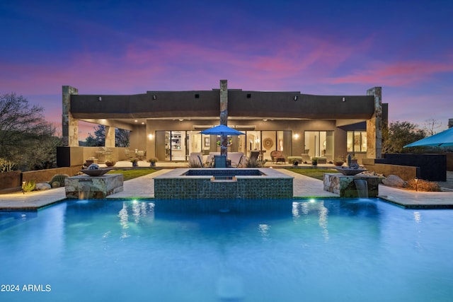 view of pool with a fenced in pool, an in ground hot tub, and a patio