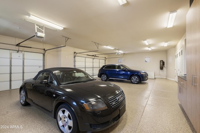 garage featuring baseboards and a garage door opener