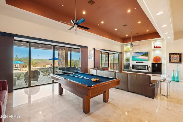 recreation room with built in shelves, ceiling fan, and pool table