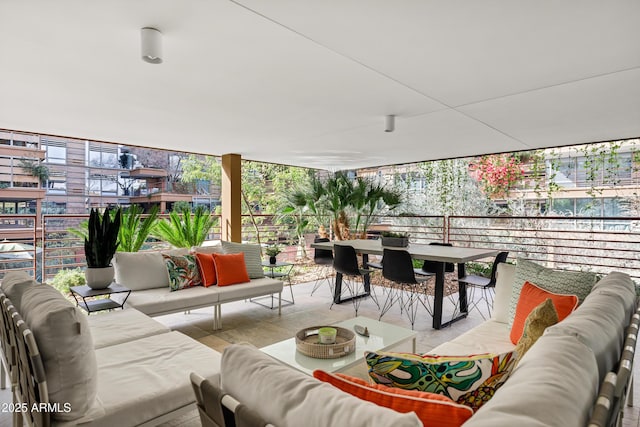 view of patio with an outdoor hangout area and a balcony