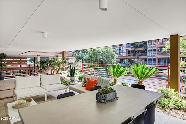 view of patio / terrace with an outdoor living space and a balcony