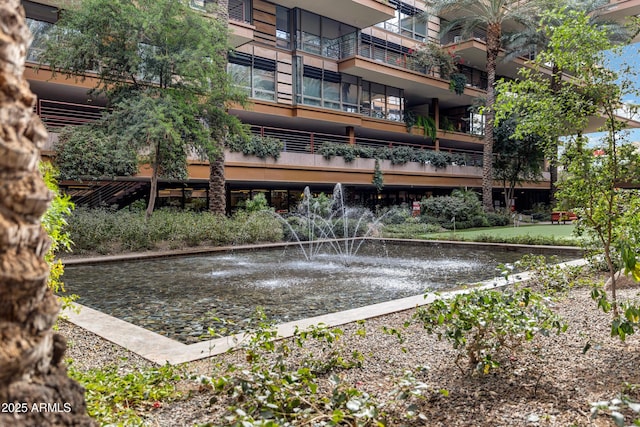 surrounding community featuring a water view