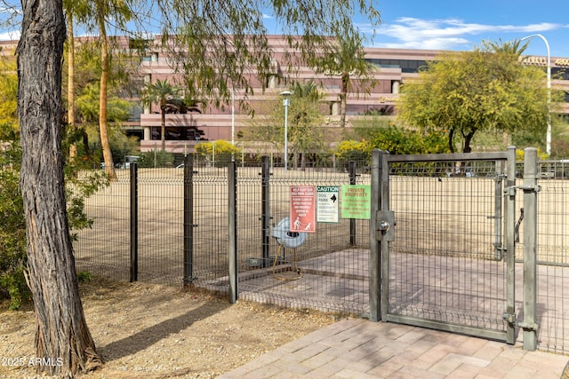 view of gate with fence