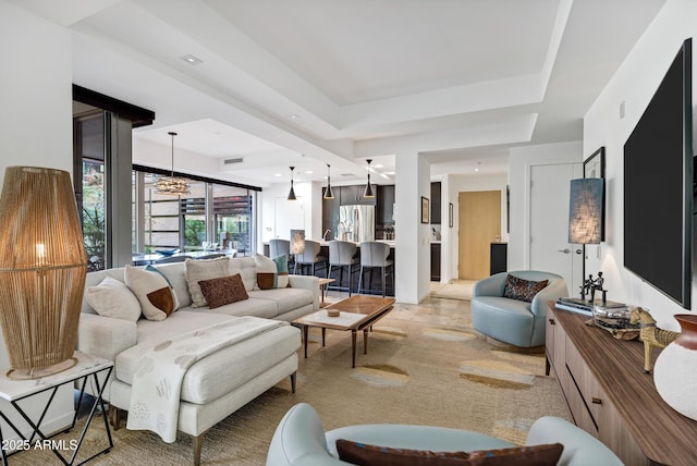 living area featuring a tray ceiling