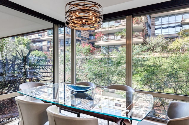 dining room featuring a chandelier and a wealth of natural light