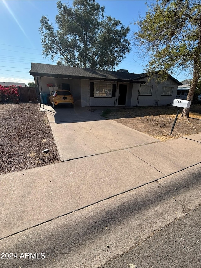 view of front of house with a carport