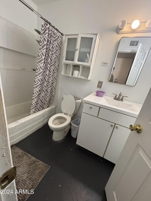 full bathroom featuring vanity, shower / bath combo, and toilet