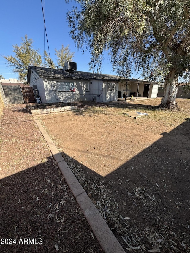 back of property featuring central air condition unit