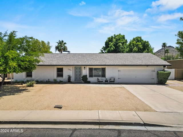 ranch-style house featuring a garage