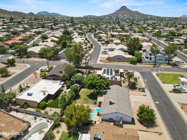 birds eye view of property featuring a mountain view